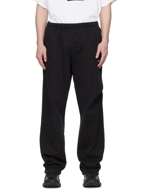 we11done Black Logo-Print Track Pants for men