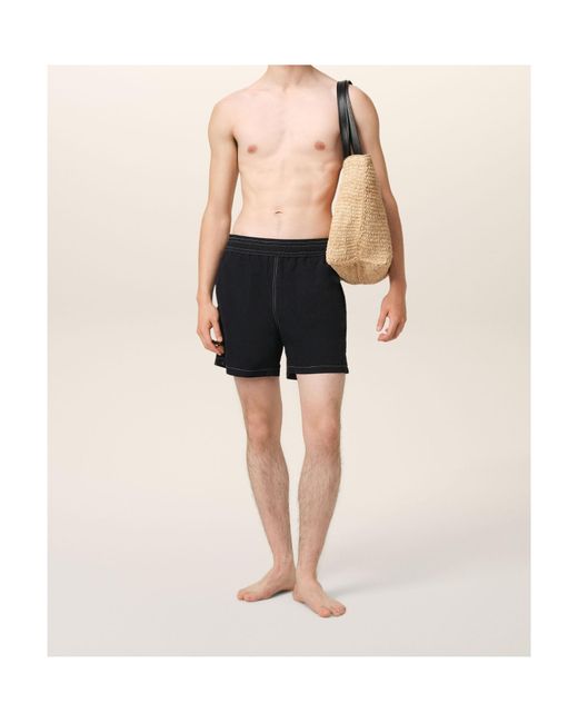 AMI Black Logo Embroidered Swim Shorts for men