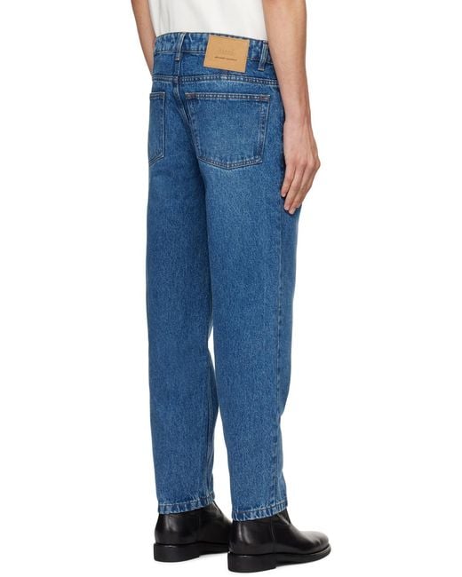 AMI Blue Logo Patch Tapered-Fit Jeans for men