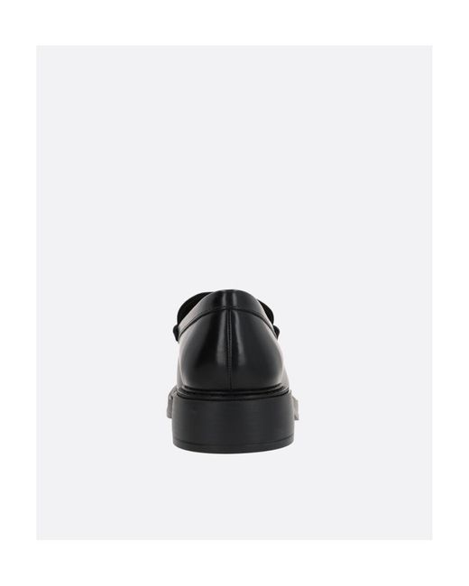 Tod's Black Almond Toe Penny Loafers for men