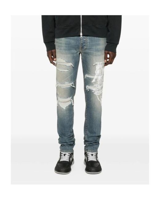 Amiri Blue Ripped Graphic Printed Jeans for men