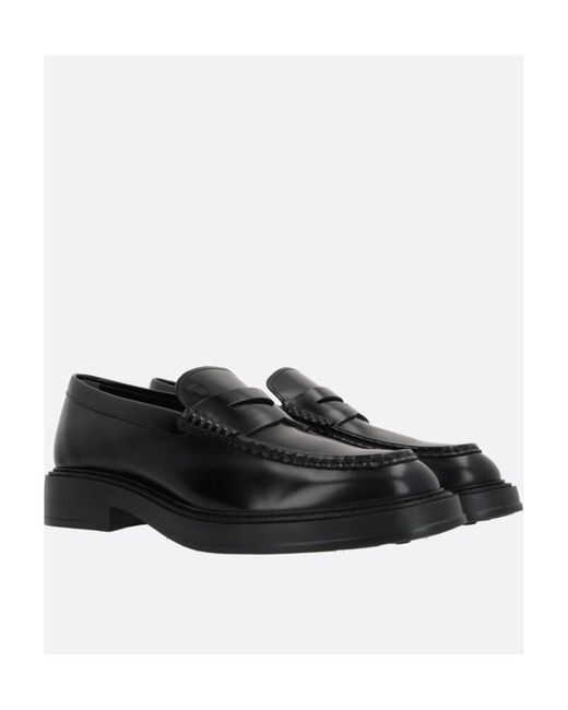Tod's Black Almond Toe Penny Loafers for men