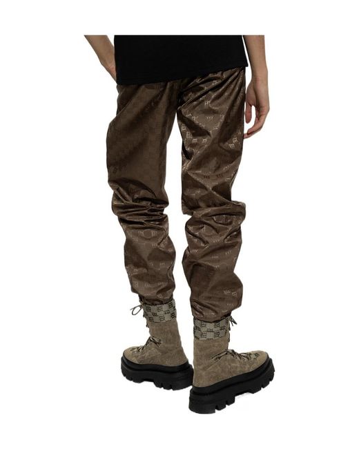 M I S B H V Brown Monogram Printed Tapered-Leg Trackpants for men