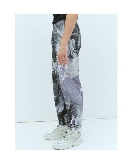 PRAYING Blue Garbage Graphic Track Pants for men