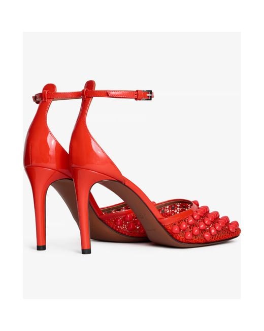 Alaïa Red Studded Fishnet Pumps