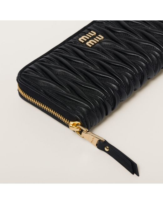 Miu Miu Matelassé Zipped Wallet in Black | Lyst UK