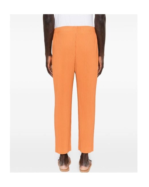 Homme Plissé Issey Miyake Orange March Pleated Trousers for men