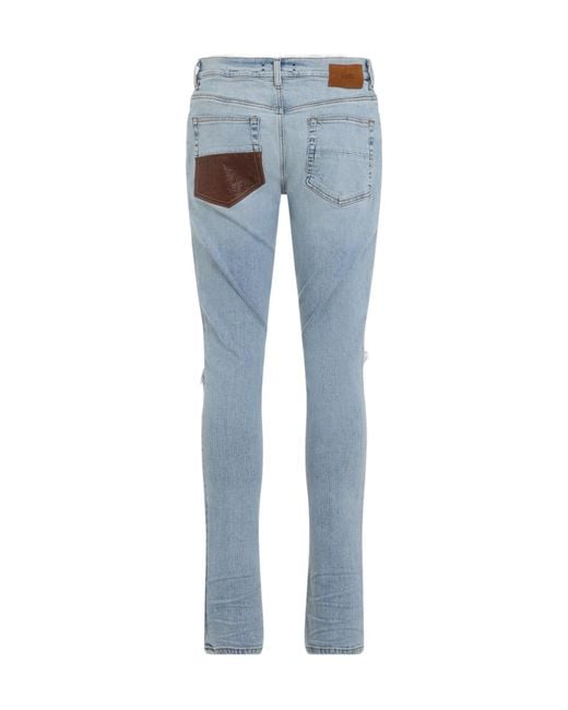 Amiri Blue Mx1 Distressed Slim Jeans for men