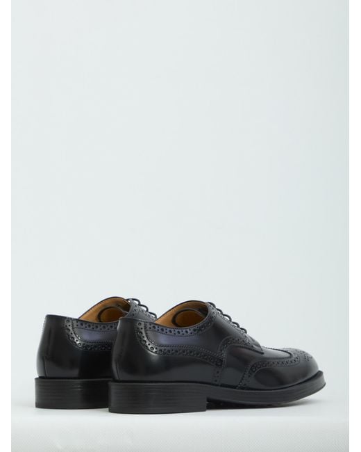 Tod's Black Wingtip Brogue Derby Shoes for men