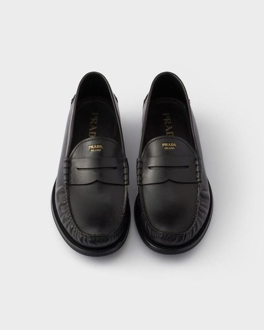 Prada Black Distressed Penny Loafers for men