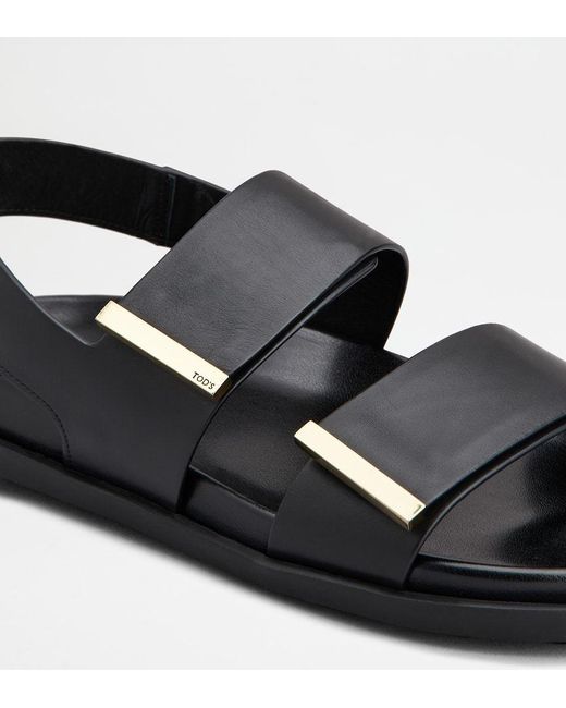 Tod's Black Logo Engraved Slip-On Sandals