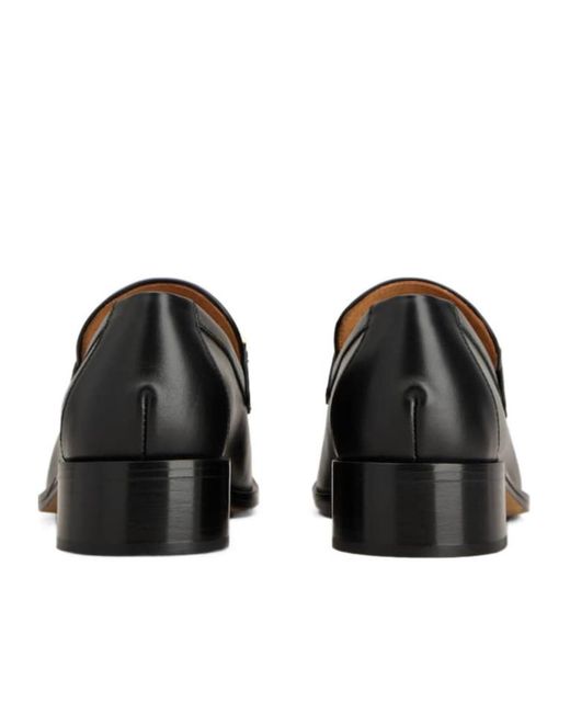 Tod's Black Logo Engraved Loafers
