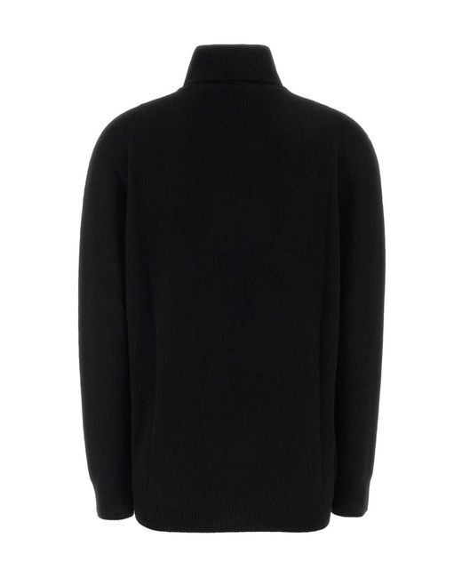 The Row Black Long-Sleeved Turtleneck Sweater