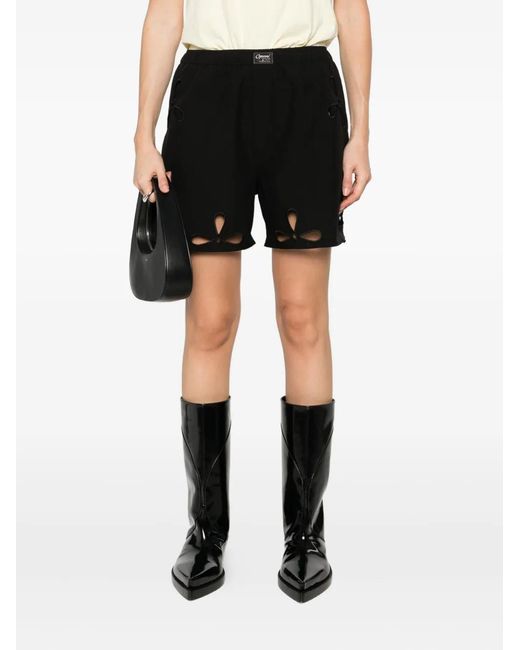 Coperni Black Petal Cut-Out Shorts for men