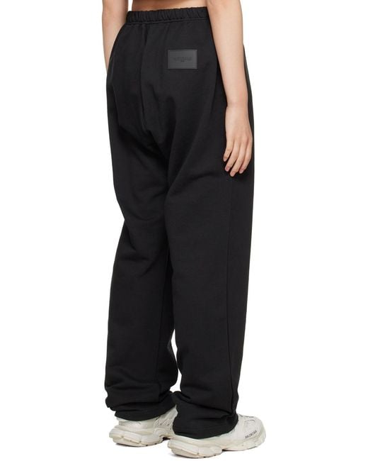we11done Black Logo-Print Track Pants for men