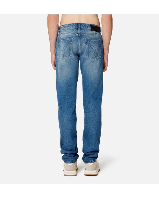 AMI Blue Logo Patch Tapered-Leg Jeans for men