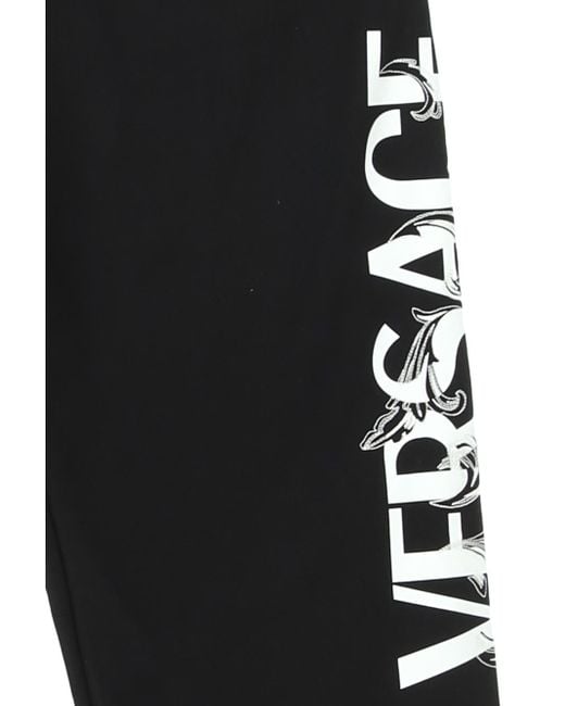 Versace Black Logo Printed Tapered Track Trousers for men