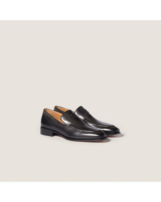 Miu Miu Black Logo-Embossed Mocassinis