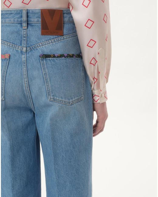 Valentino Blue Denim Trousers With Floral Print Hem for men
