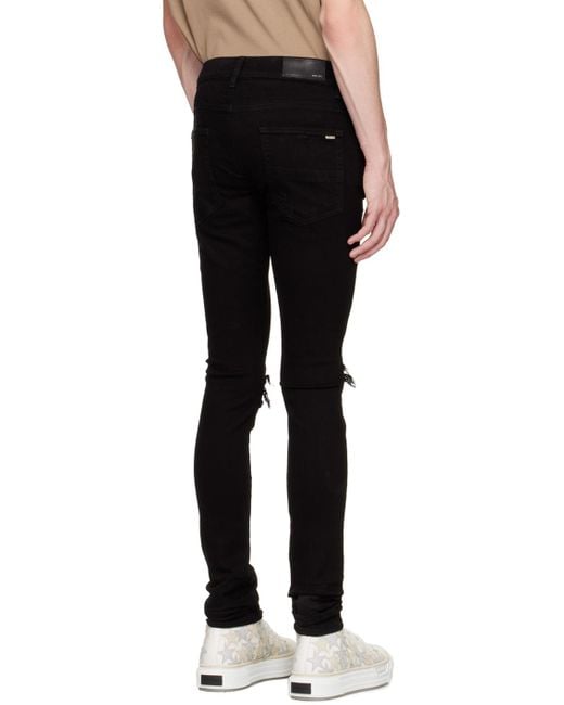 Amiri Black Mx1 Distressed Tapered Leg Jeans for men