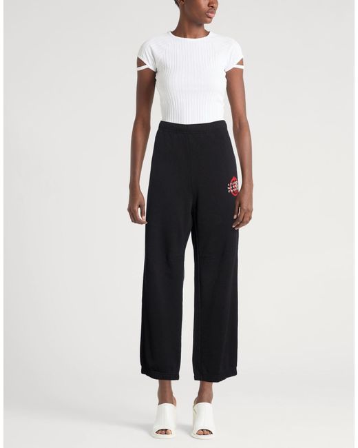 MM6 by Maison Margiela Black Solid Color Printed Casual Pants