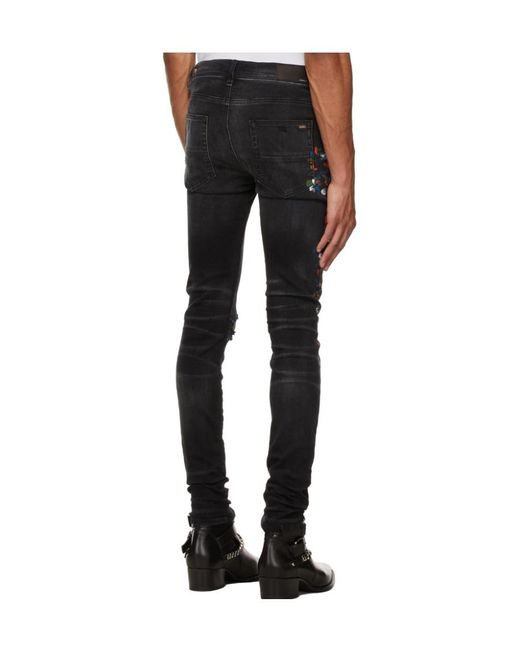 Amiri Black Paint Print Distressed Skinny Jeans for men
