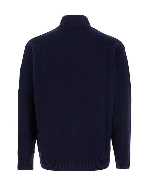 C P Company Blue High Neck Logo Plaque Jacket for men