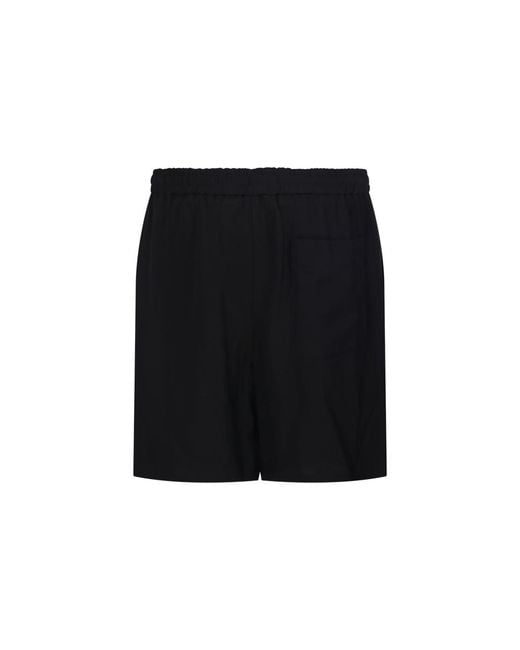AMI Black Ami Logo Detailed Buttoned Shorts for men