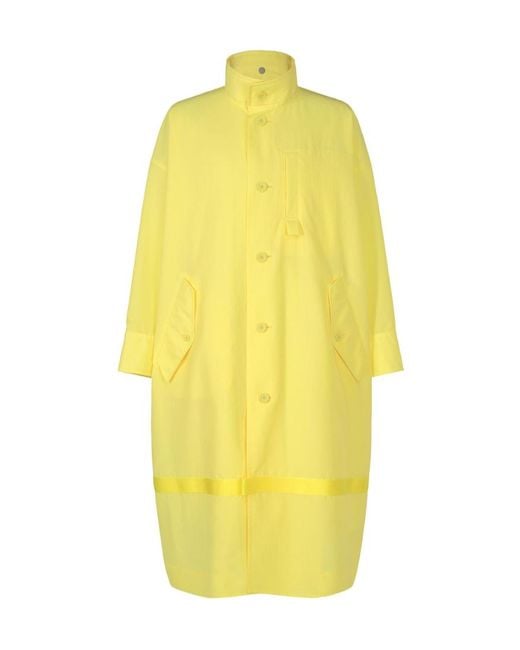 Homme Plissé Issey Miyake Yellow Carrier Carried Hooded Logo-Print Coat for men