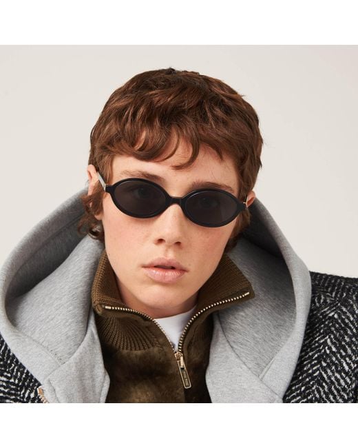 Miu Miu White Eyewear Oval Frame Full Rim Sunglasses