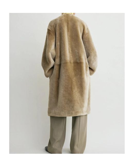 Totême Natural Collarless Shearling Coat Rye