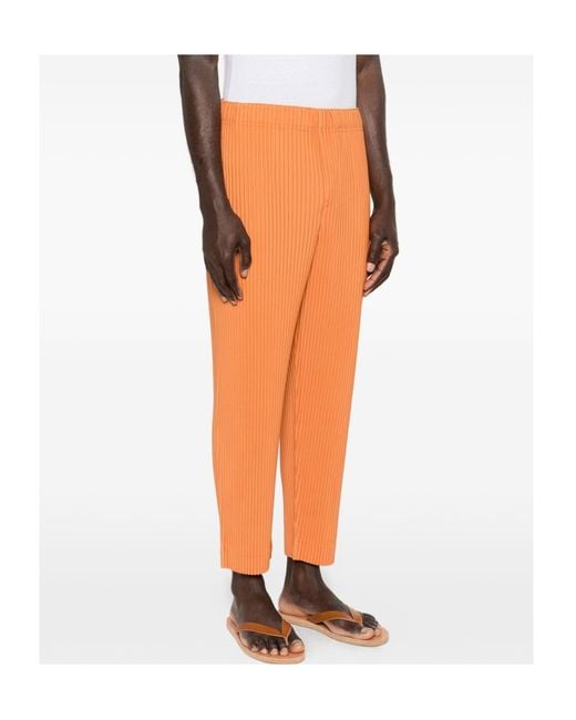 Homme Plissé Issey Miyake Orange March Pleated Trousers for men