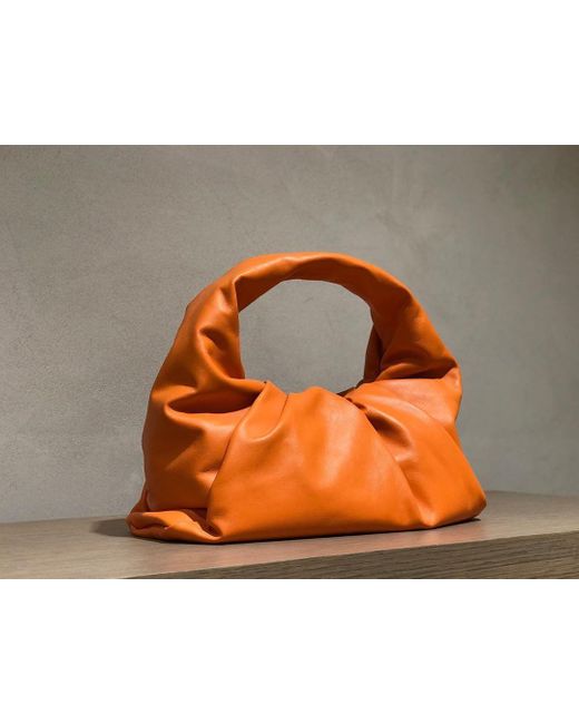 Bottega Veneta The Shoulder Pouch Bag in Orange | Lyst UK