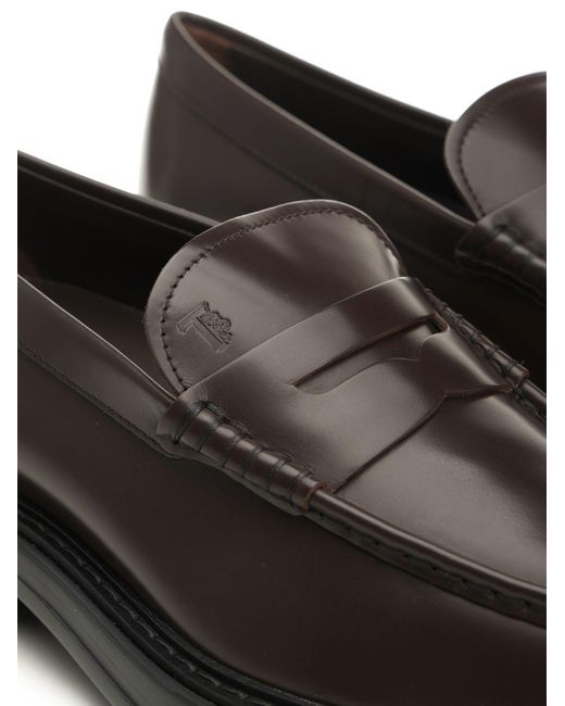 Tod's Black Almond Toe Penny Loafers for men