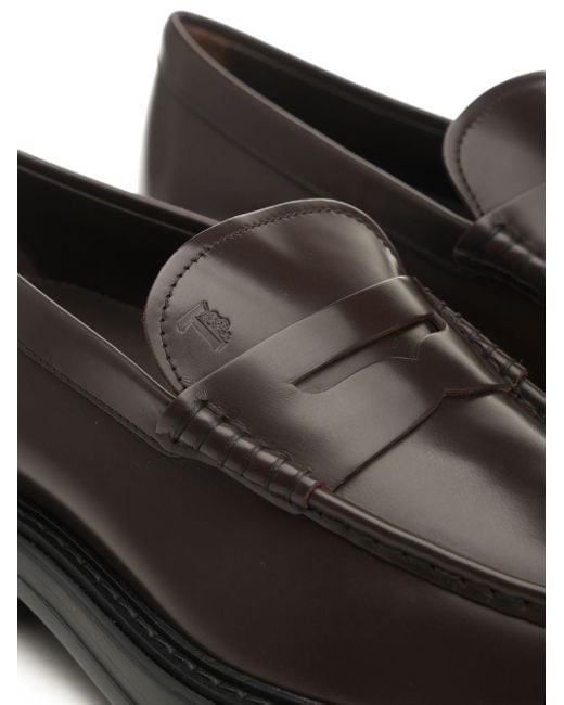 Tod's Black Almond Toe Penny Loafers for men