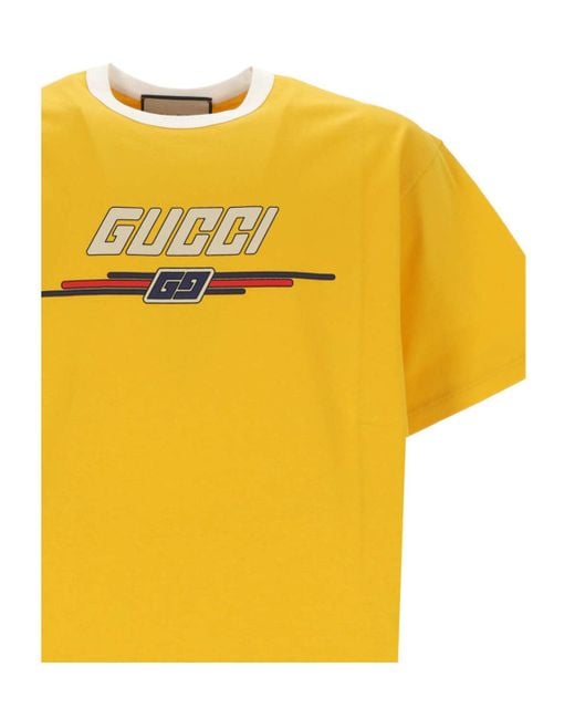 GUCCI イエロー ロゴ Tシャツ GUCCI グラフィックプリント Tシャツ