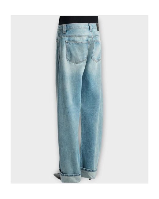 Khaite Blue Karo Low-Rise Curved Leg Jeans