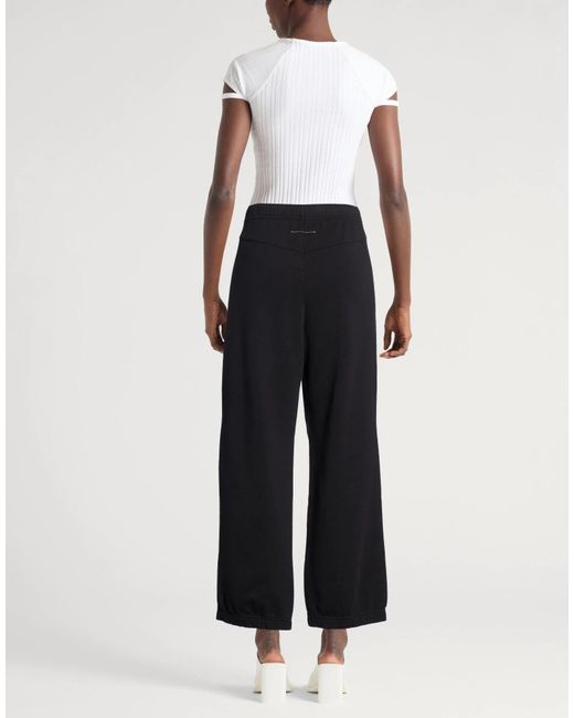 MM6 by Maison Margiela Black Solid Color Printed Casual Pants