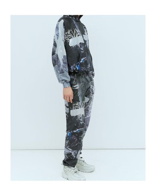 PRAYING Blue Garbage Graphic Track Pants for men
