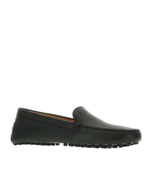 Tod's Black Round-Toed Flat Shoes