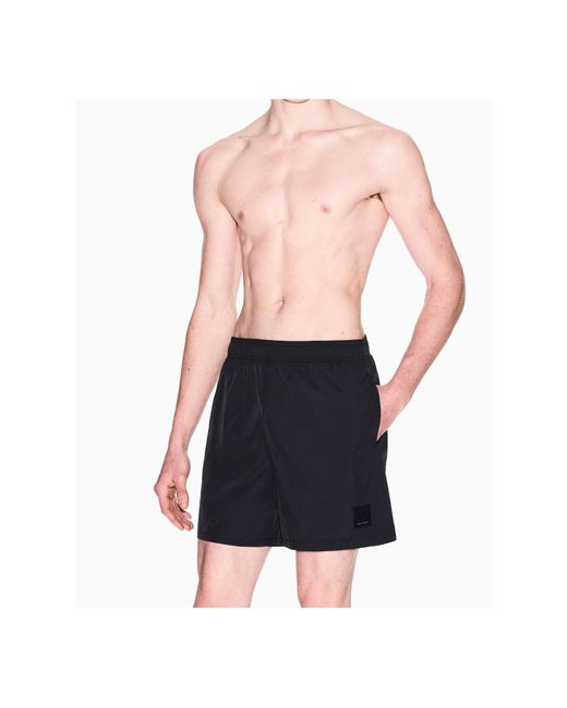 ARMANI EXCHANGE Black Logo-Patch Swim Shorts for men