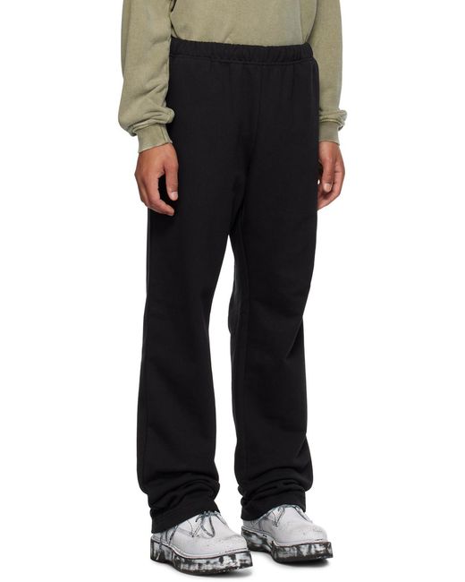 we11done Black Logo-Print Track Pants for men