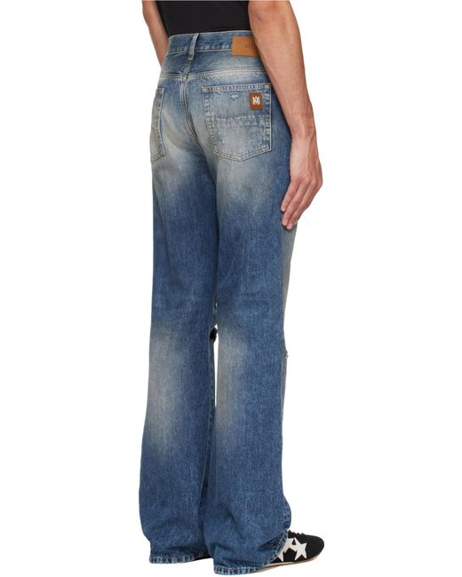 Amiri Blue Ripped-Knees Bootcut Denim Jeans for men