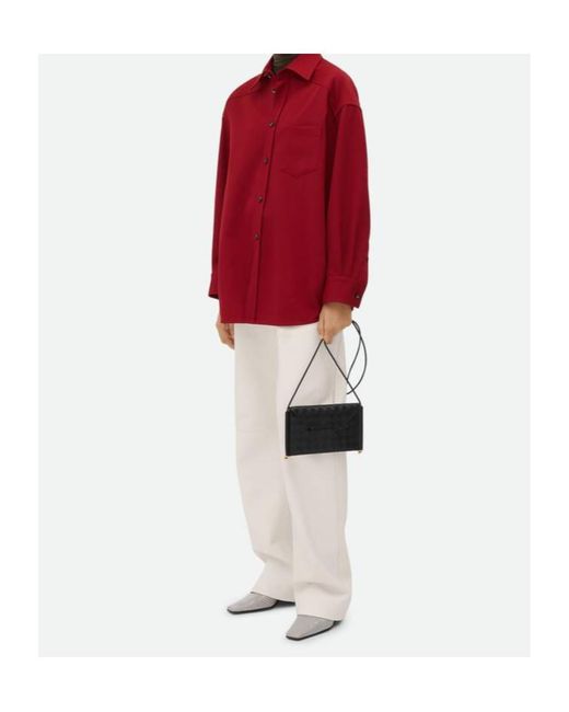 Bottega Veneta Solstice Horizontal Phone Pouch in Black | Lyst