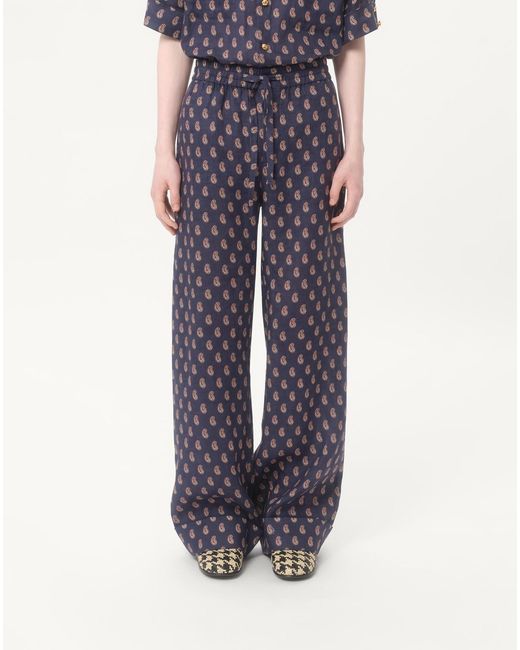 Valentino Blue Lightweight Cuffed Linen Trousers With Voyage Imaginaire Print for men