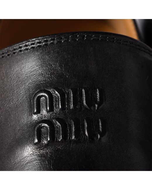 Miu Miu Black Logo-Embossed Mocassinis