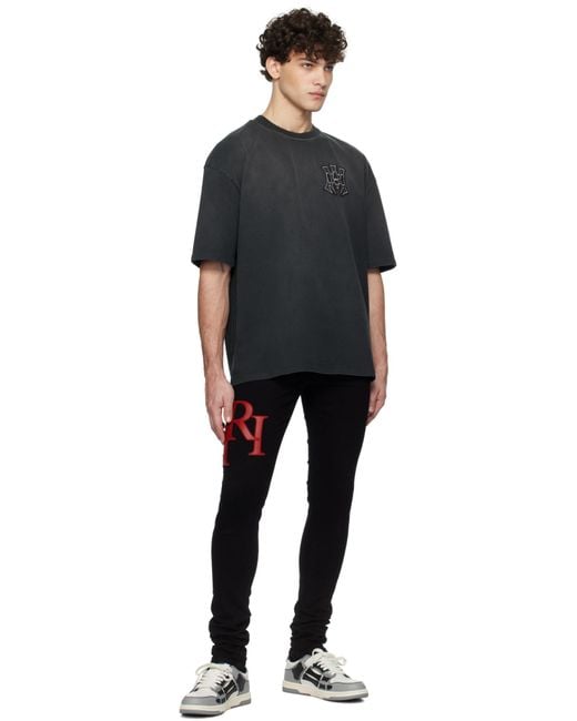 Amiri Black Logo Appliqué Skinny Jeans for men