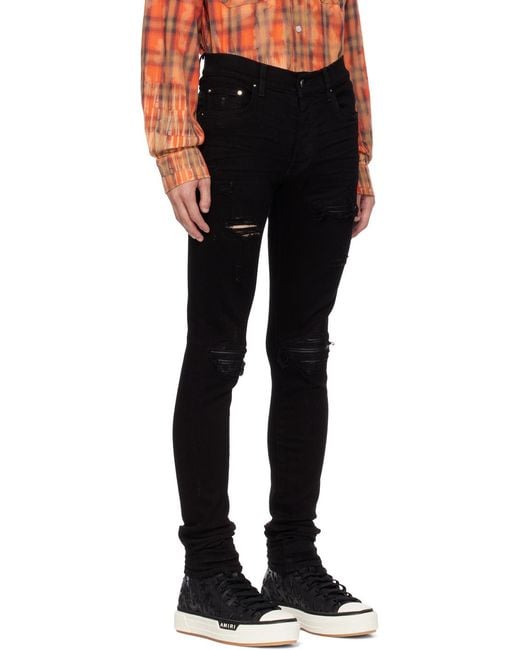 Amiri Black Mx1 Distressed Tapered Leg Jeans for men
