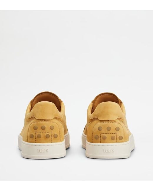 Tod's Yellow Logo Stamped Lace Up Sneakers for men