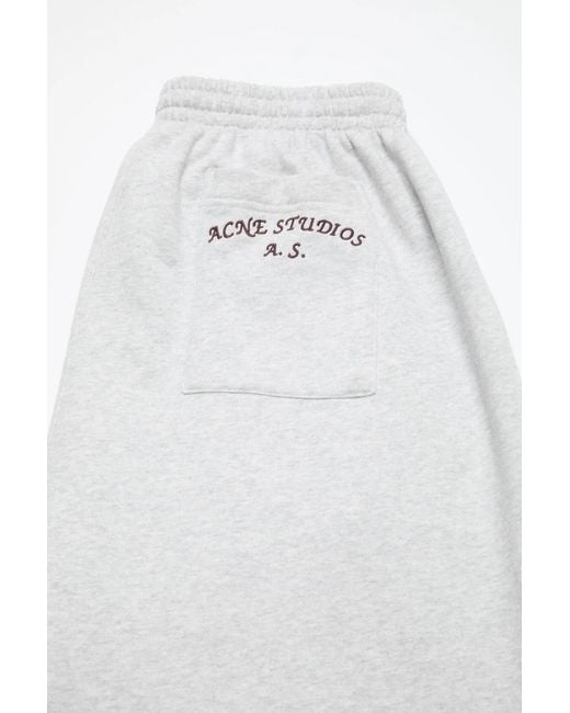 Acne White Logo Embroidered Trousers for men